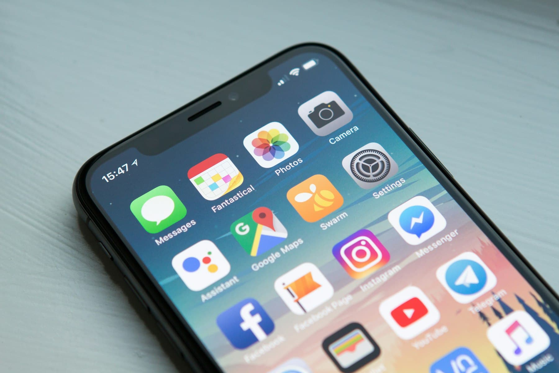 A smartphone home screen full of app icons